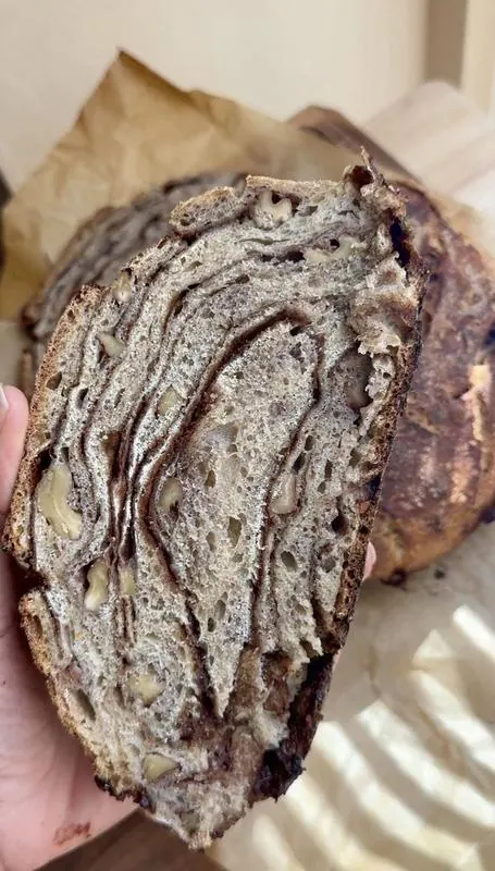 Slice of walnut bread showing the crumb