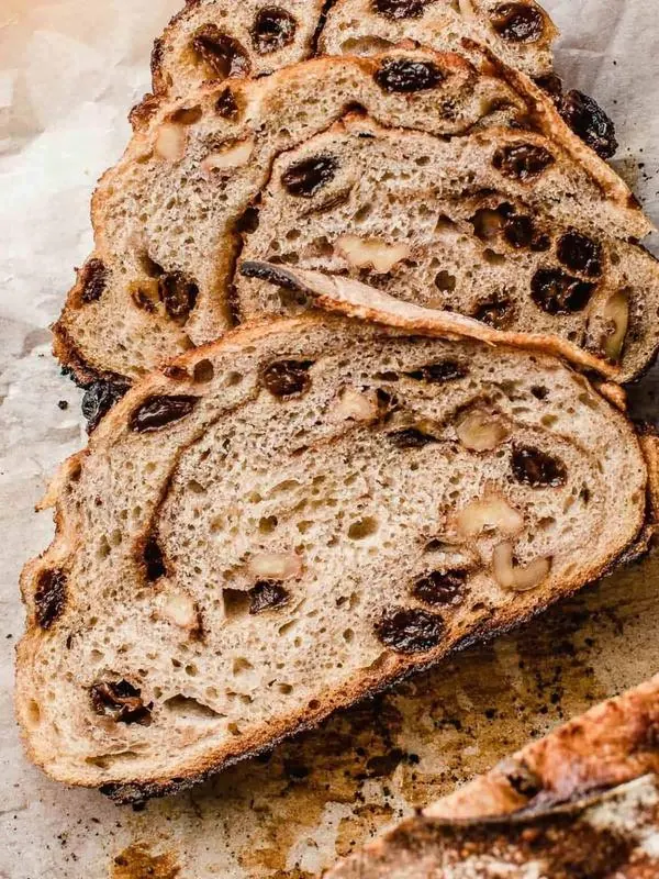 Slices of raisin walnut bread showing the crumb