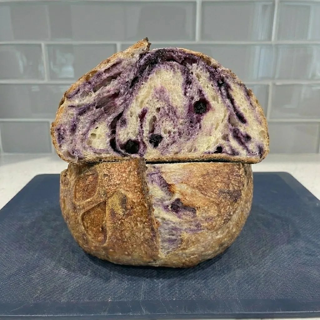 Lemon blueberry sourdough bread, sliced to show the crumb
